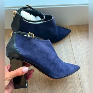 Jimmy Choo navy suede bootie with ankle strap and patent black heel